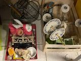 many dishes and utensils on the floor in the kitchen
