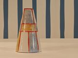 a white and red vase sitting on a table