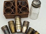 a basket of salt and pepper shakers next to a basket of salt and pepper shakers
