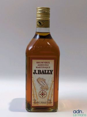 a bottle of whiskey that is sitting on a table