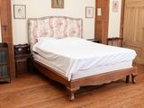 a bed that is in the middle of a room