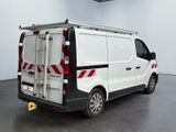 a white van with a ladder on the back of it