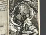 an old book with a picture of a man and a woman sitting on top of it