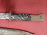 a knife that is laying on a red surface