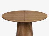 an image of a round wooden table with a circular base