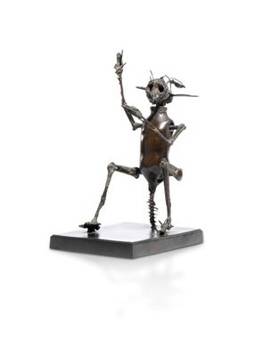 statue of a man holding a knife and a knife in his hand