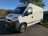 a white van that is parked on the side of the road