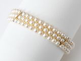 pearl bracelet on a napkin on a white background