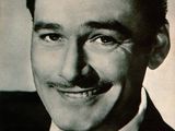 a black and white photo of a man in a suit and tie