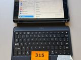 a laptop and a tablet sitting on a table next to each other