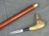 a picture of a knife and a cane on a table
