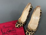 christian loubouti leopard print pumps with red velvet bag