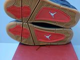 the sole of a pair of blue and red shoes on a pink mat