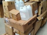 a pile of boxes and containers sitting on a pallet