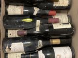 many bottles of wine in a box on the table