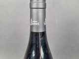 a bottle of wine that is sitting on a table