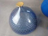 a blue vase and a blue vase sitting on a table