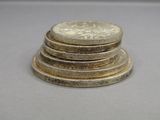 several coins stacked on top of each other on a table
