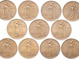 a close up of a bunch of coins on a white surface