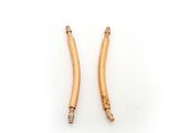 a pair of gold plated brass earrings on a white background
