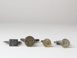 three different types of cuff rings with coins on them