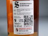 a label on a bottle of whiskey on a table