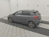 a picture of a grey car in a garage