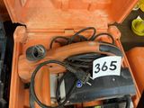 an orange tool box with a charger and a charger in it