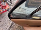 a view of a car door with a broken window