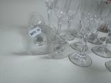 many wine glasses sitting on a table with a price tag