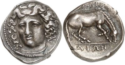 a silver coin with an image of a horse on it