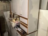 a refrigerator and a refrigerator freezer in a room