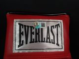 a close up of a red boxing glove with the word everlast on it