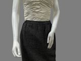 female mannequin in a black and white dress on a mannequin