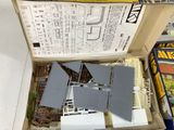 a box with a model of a house inside of it
