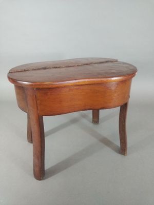 a small wooden table with a wooden top on a white background
