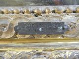 a plaque on the side of a gold plate