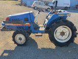 a blue tractor that is parked in a parking lot