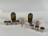 a group of small metal objects that are on a white surface