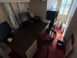 a view of a home office with a desk and a chair