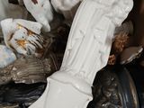 a box full of ceramic figurines sitting on a table