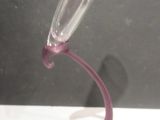 a wine glass that is sitting on top of a table