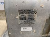 a close up of a parking meter with a sticker on it