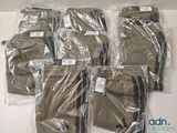six pairs of men ' s pants wrapped in plastic on a white surface