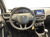 the interior of a car with a steering wheel and dashboard controls