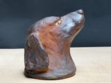 a statue of a dog that is sitting on a table