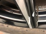 a close up of a car ' s rim with a sticker on it
