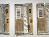 three packages of chocolate sitting on a table