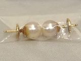 a pair of pearls in a bag on a table