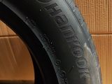 a close up of a tire on a cardboard box with a cardboard box in the background